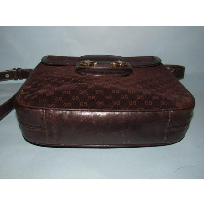 RARE, Gucci, mod, 1955 Horse-bit, dark brown micro Guccissima print embossed suede and leather shoulder bag with an envelope top, two strap lengths, and bold gold horse bit accents