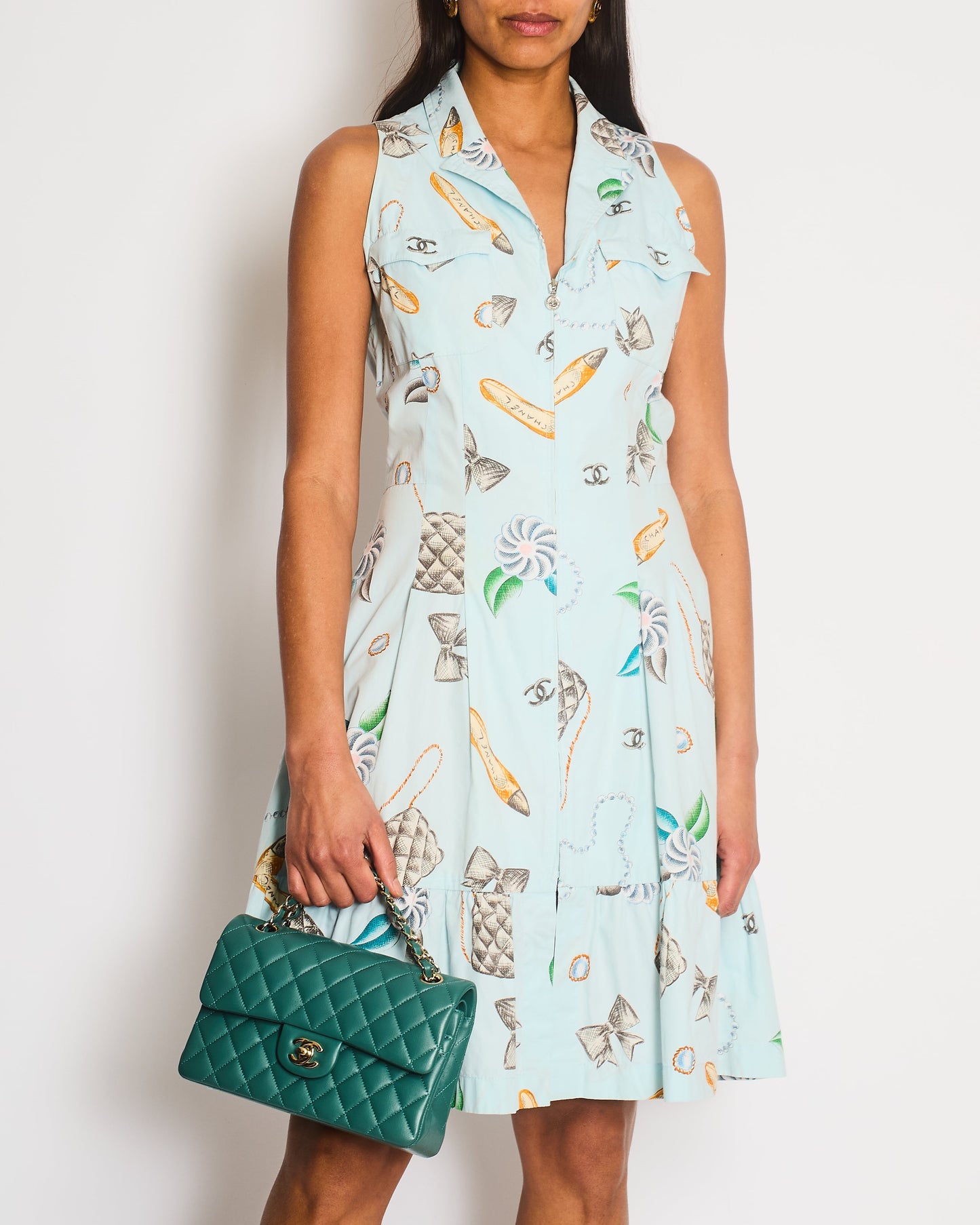 Chanel   96P Light Blue Sleeveless Mini Dress with Camelia, Bow and Pearl Prints with Silver CC Logo Front Zipper Detail Size FR 40 (UK 12)