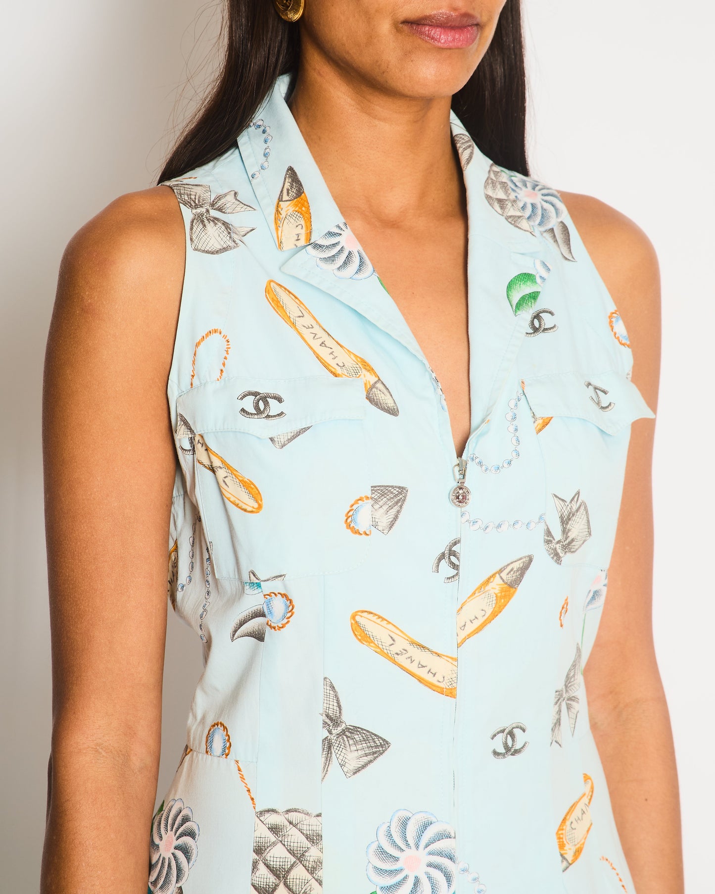 Chanel   96P Light Blue Sleeveless Mini Dress with Camelia, Bow and Pearl Prints with Silver CC Logo Front Zipper Detail Size FR 40 (UK 12)