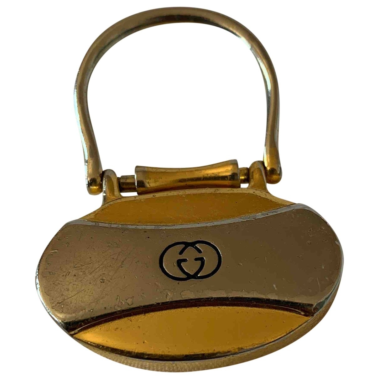 Gucci gold metal case