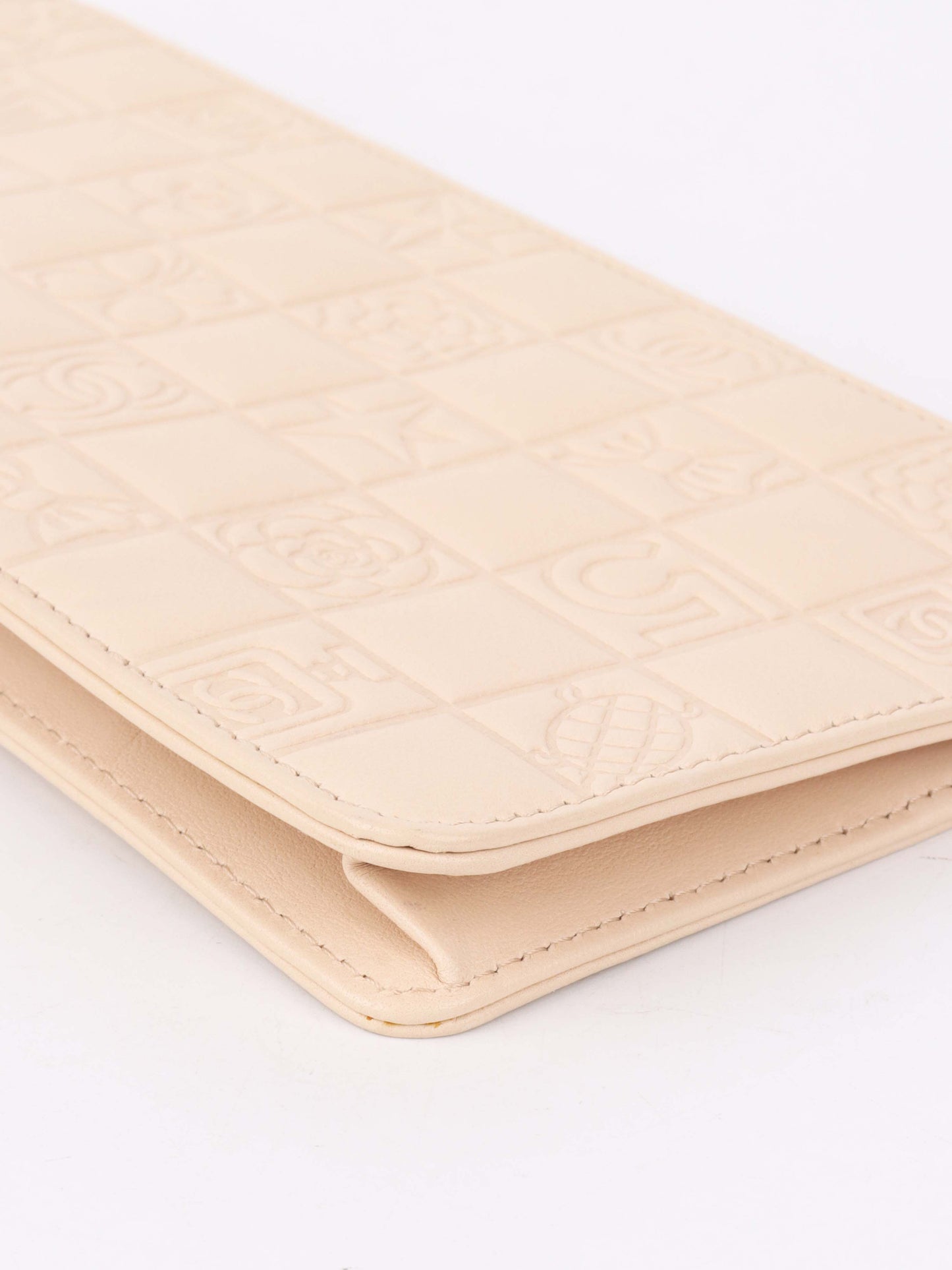 Chanel Beige Lucky Embossed Symbols Pochette with Wristlet Chain.
