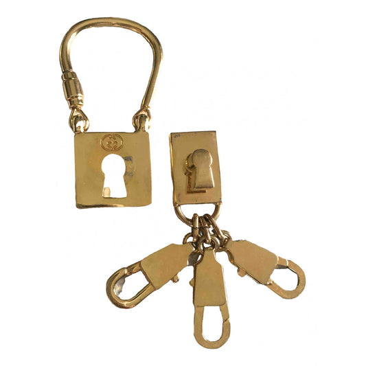 Gucci gold metal bag charms