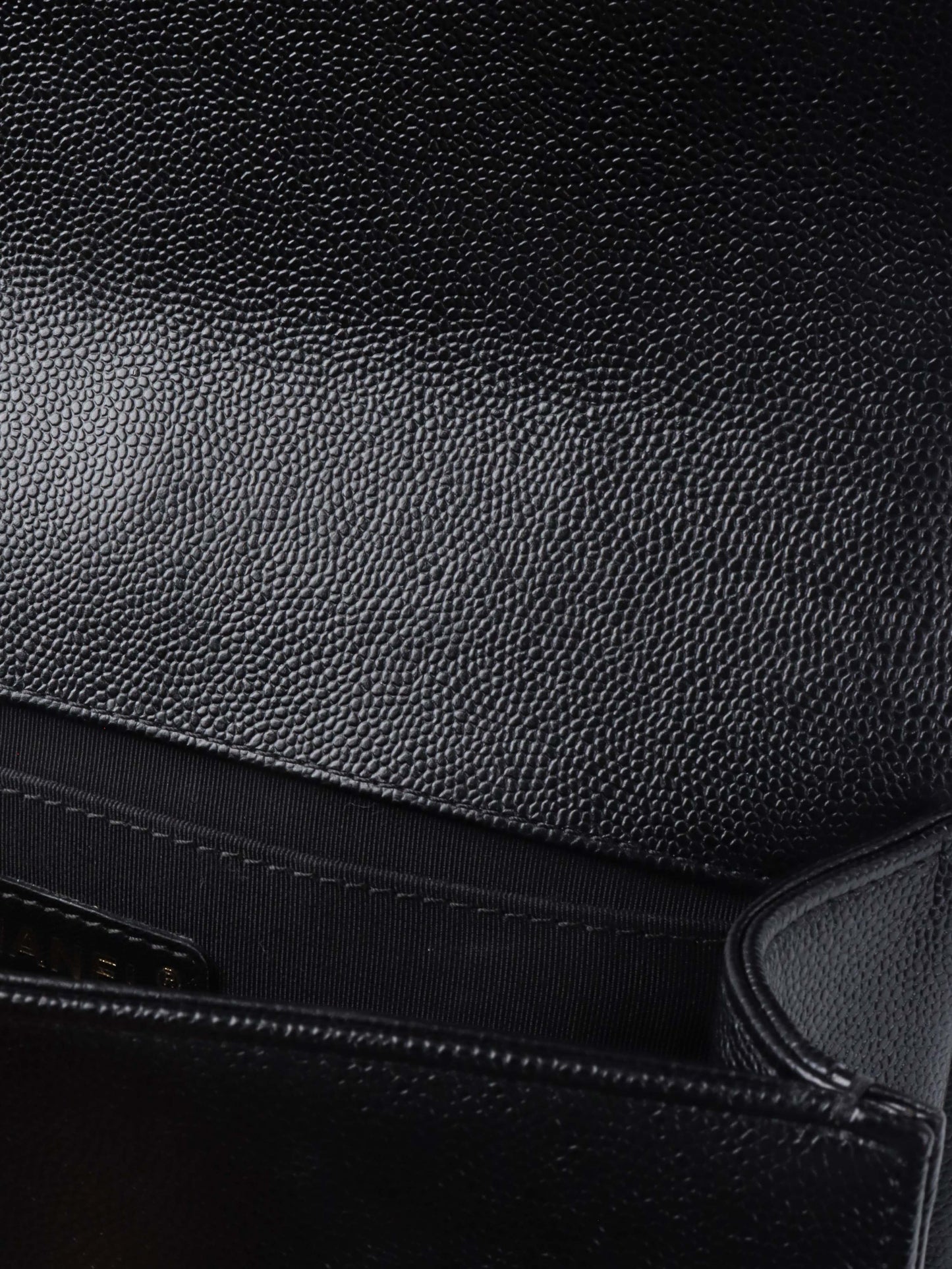 Chanel Black Chevron Caviar Medium Boy Bag.