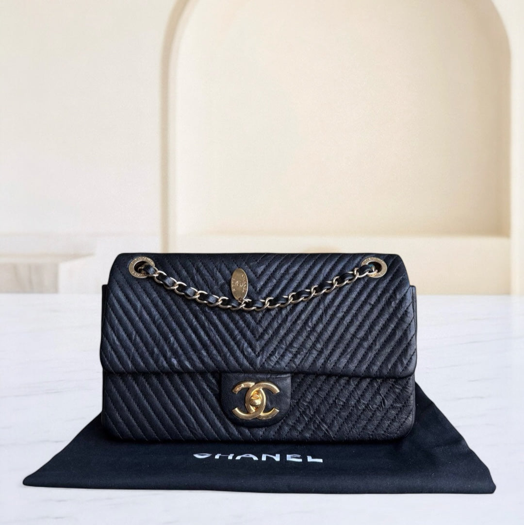 Chanel Seasonal Flap - Chevron Surpique CC Herringbone Medallion Calfskin Flap Black Gold Hardware Series 22