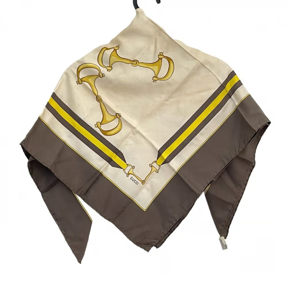 , Gucci, equestrian print, 35" square, 100 % silk scarf in brown, gold, & black on a white background with a wide brown border