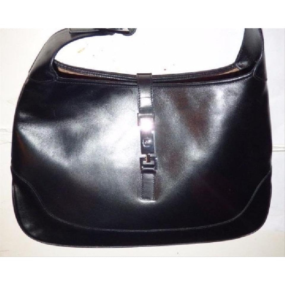 - Gucci, extra large size, classic, Jackie- O bag, made in hard to find,black all leather with a chrome piston closure and buckle