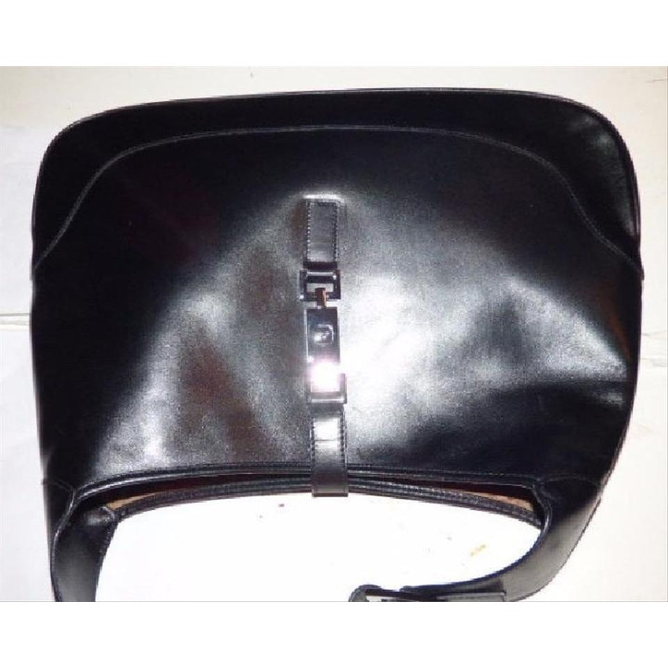 - Gucci, extra large size, classic, Jackie- O bag, made in hard to find,black all leather with a chrome piston closure and buckle