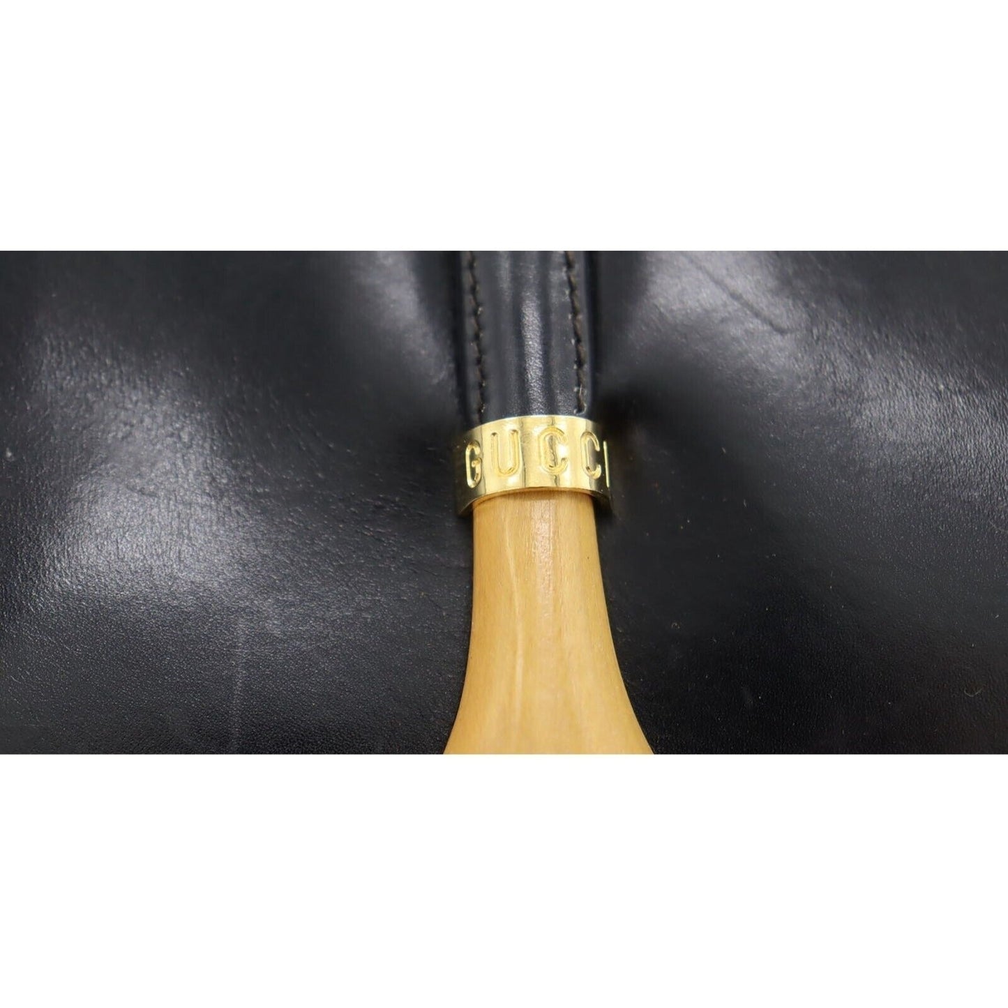 , navy leather, Gucci shoulder bag with XL gold & tan leather horsebit accent with cut-out & 'GUCCI' engraved on top