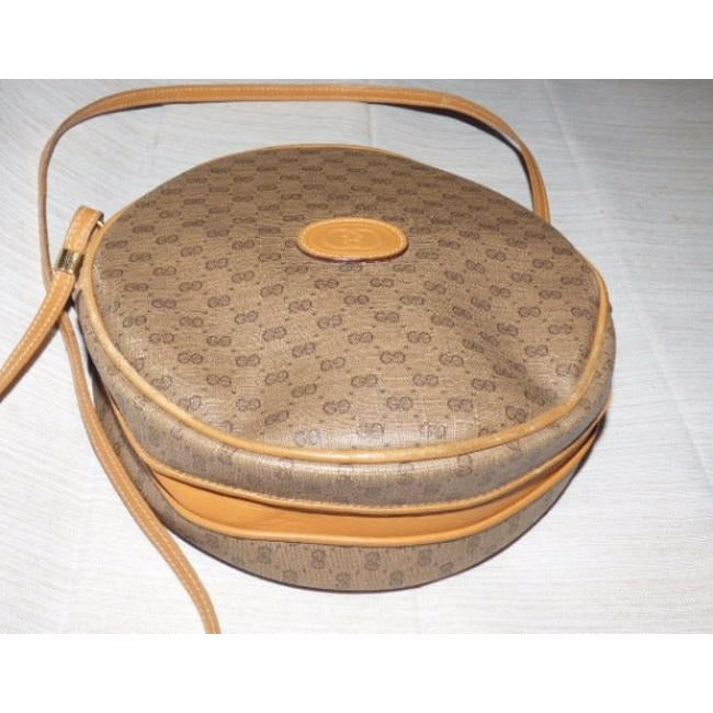 Gucci   Camel Leather And Small G Logo Print Coated Canvas In Shades Of Browns