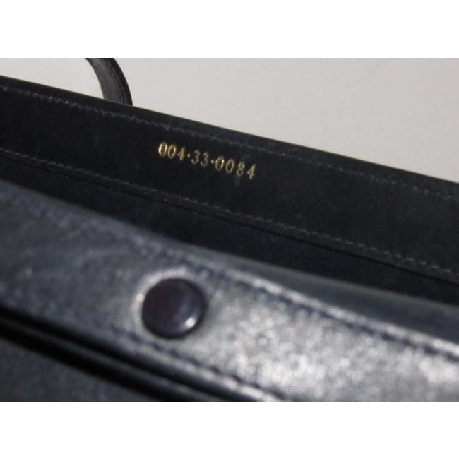 Gucci   Dark Navy Blue Leather With A Cool Gold And Leather Bamboo Accent