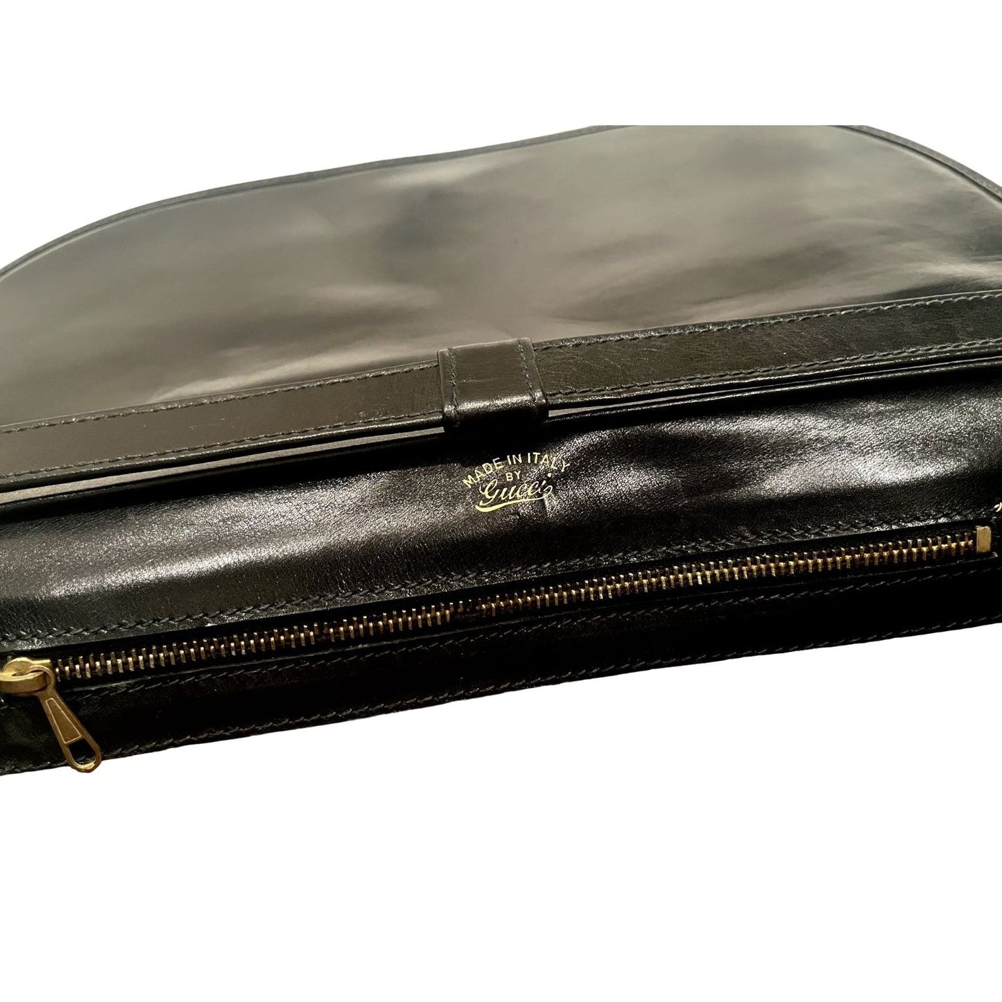 , rare, black leather, Gucci shoulder bag with a large, two-tone 'GG' emblem and removable strap