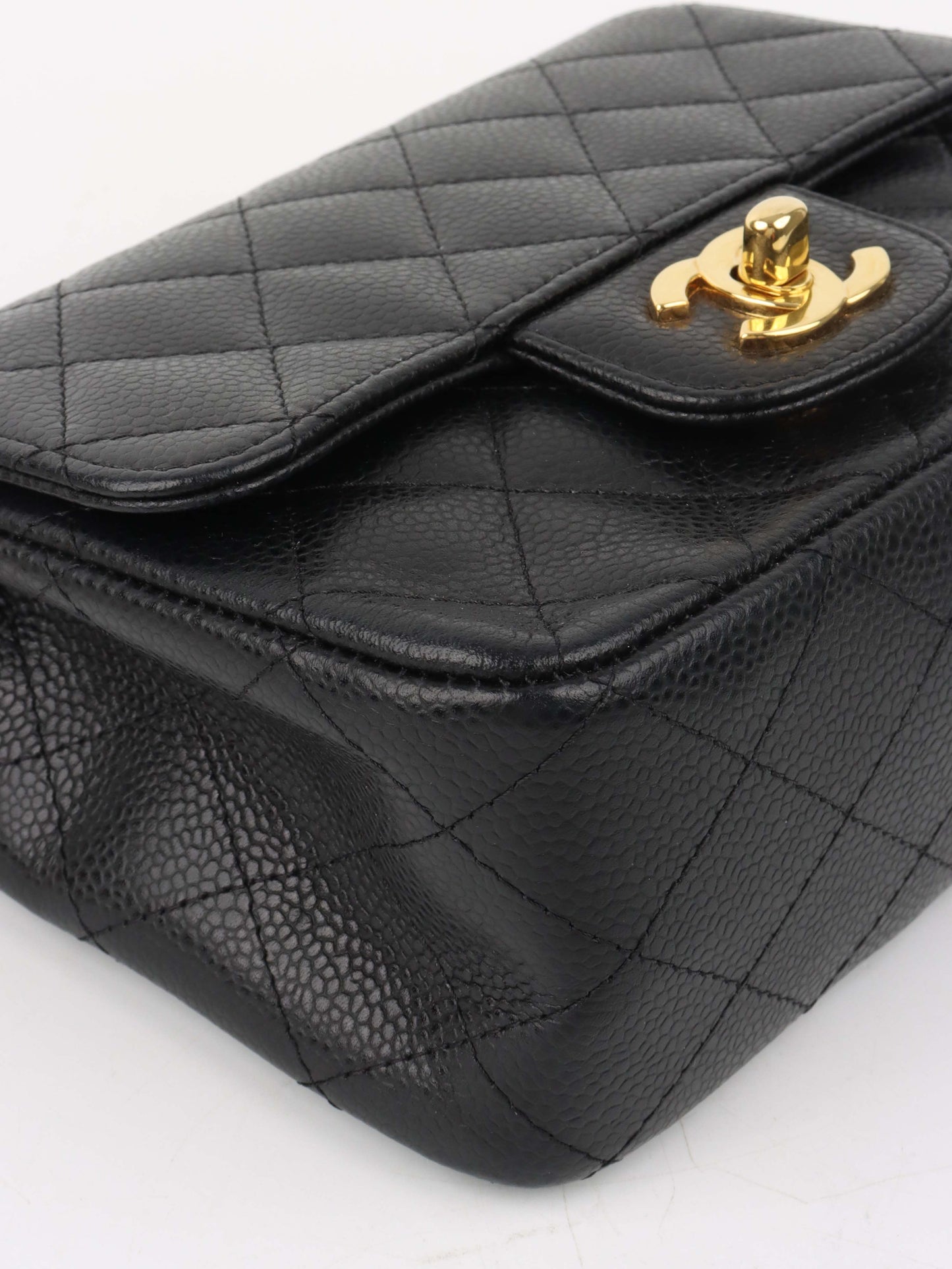 Chanel Black Mini Caviar Square Flap Bag.