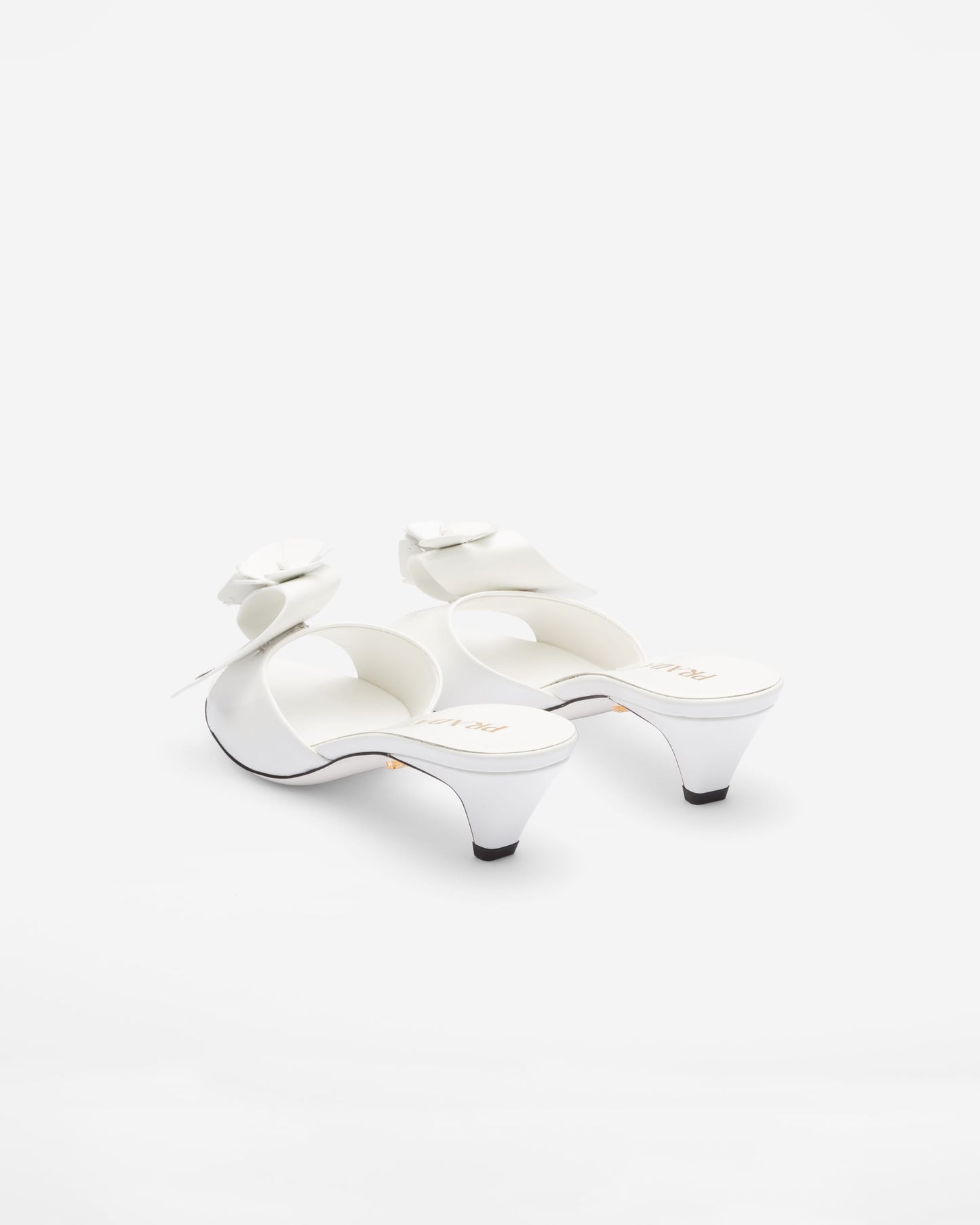Bianco patent leather heeled mules with prada logo