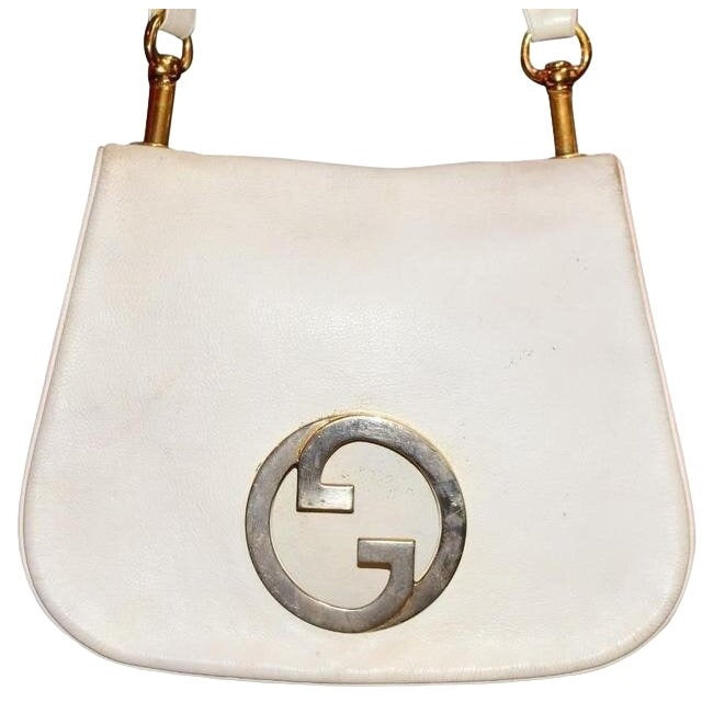 1970s Gucci white textured leather Blondie style saddle bag with XL gold GG logo cutout in mint condition