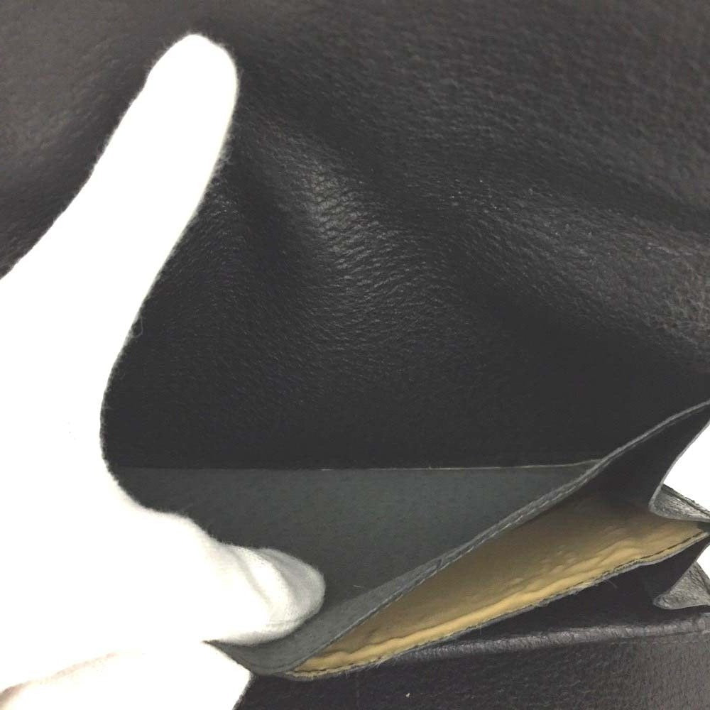 Unique,  , Gucci, RARE, black leather, clutch style purse or extra large wallet with a gold horse-bit accent at the clasp