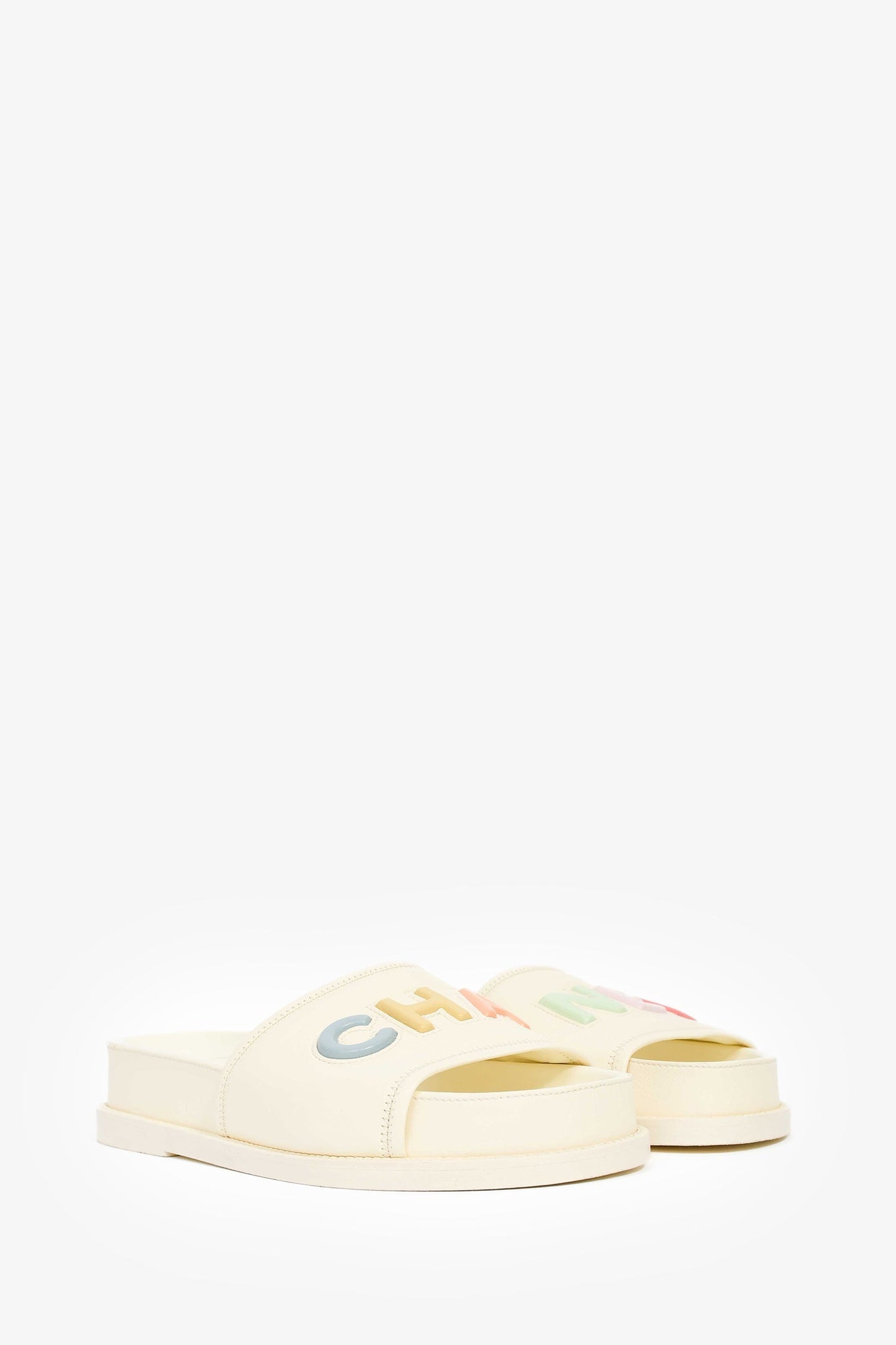 Pre-Loved Chanel™ 2022 Cream Leather Pastel 'CHANEL' Slides Size 38