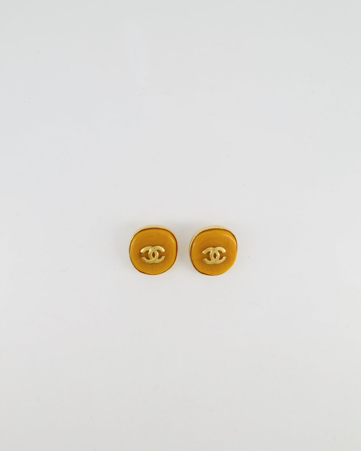 Chanel   98P Orange Rounded Clip On Earrings with Gold Rim and CC Logo Detail