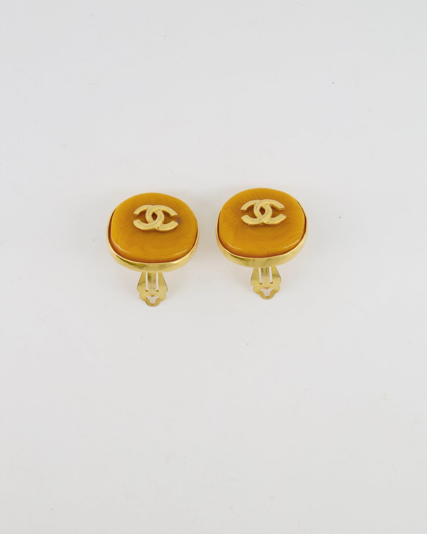 Chanel   98P Orange Rounded Clip On Earrings with Gold Rim and CC Logo Detail