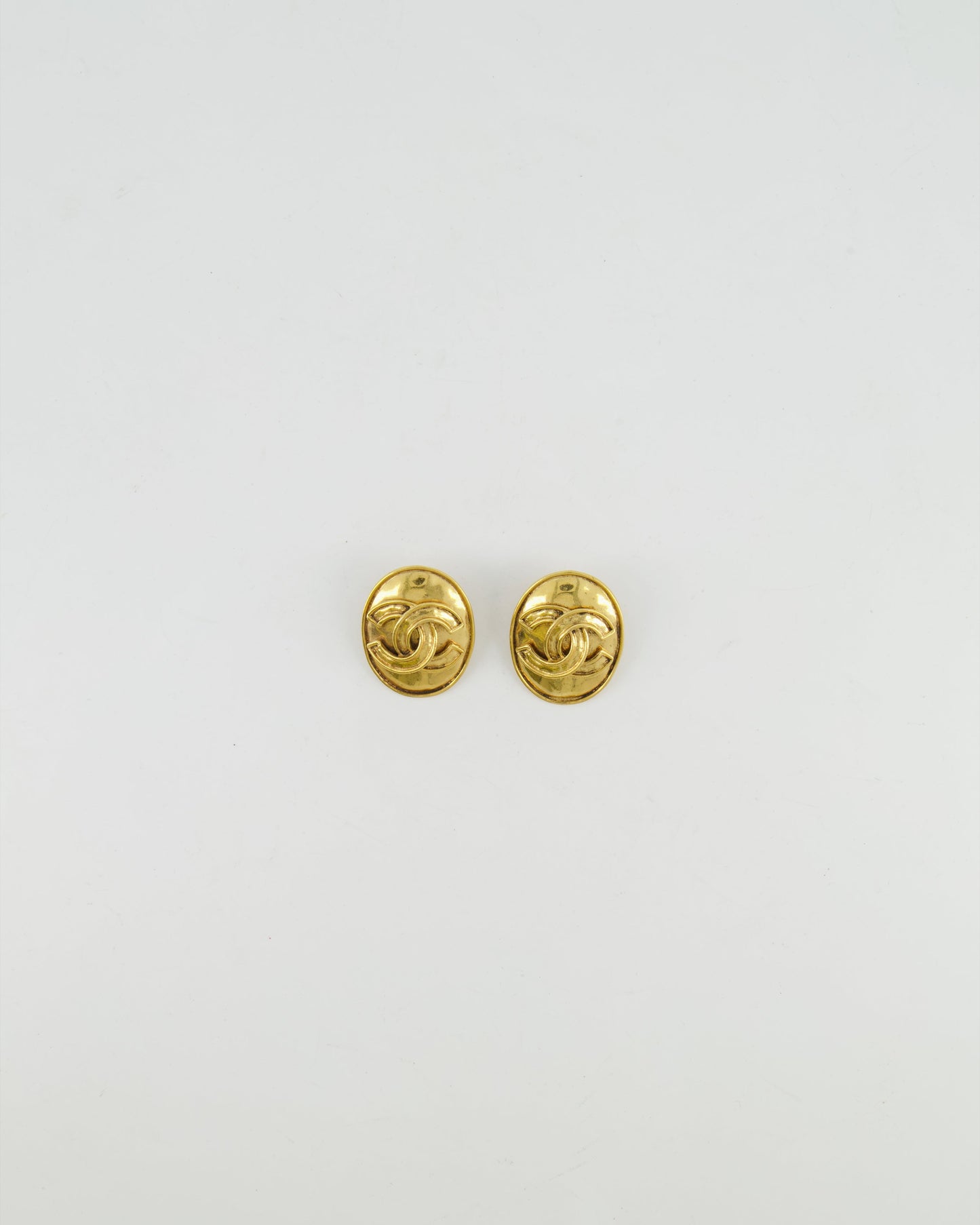 Chanel   94P Gold Polished Oval Clip On Earrings with CC Logo