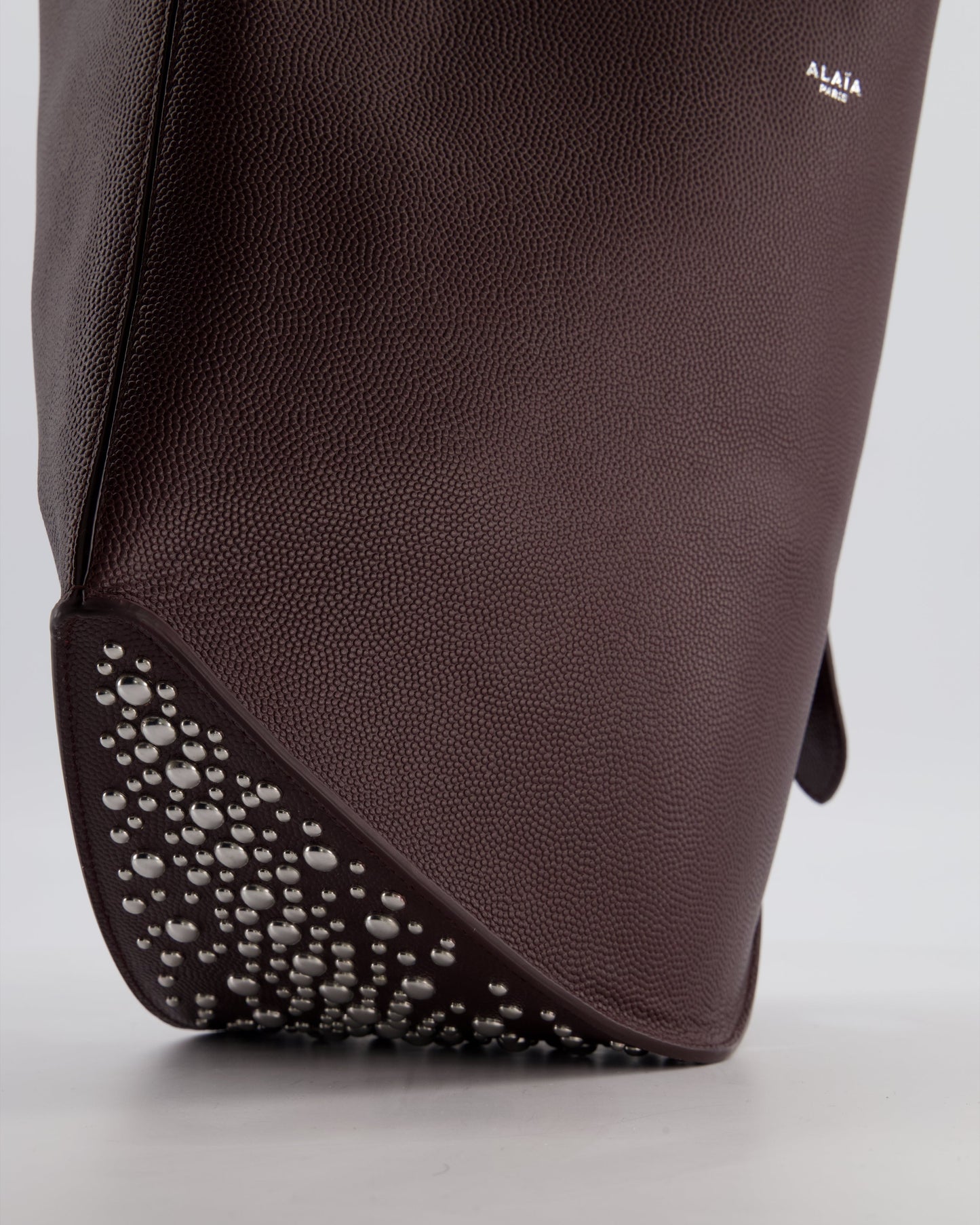 Alaïa Le Gail Large Leather Tote Bag with Adjustable Shoulder Strap with Adorned Studs and Silver Studded Base