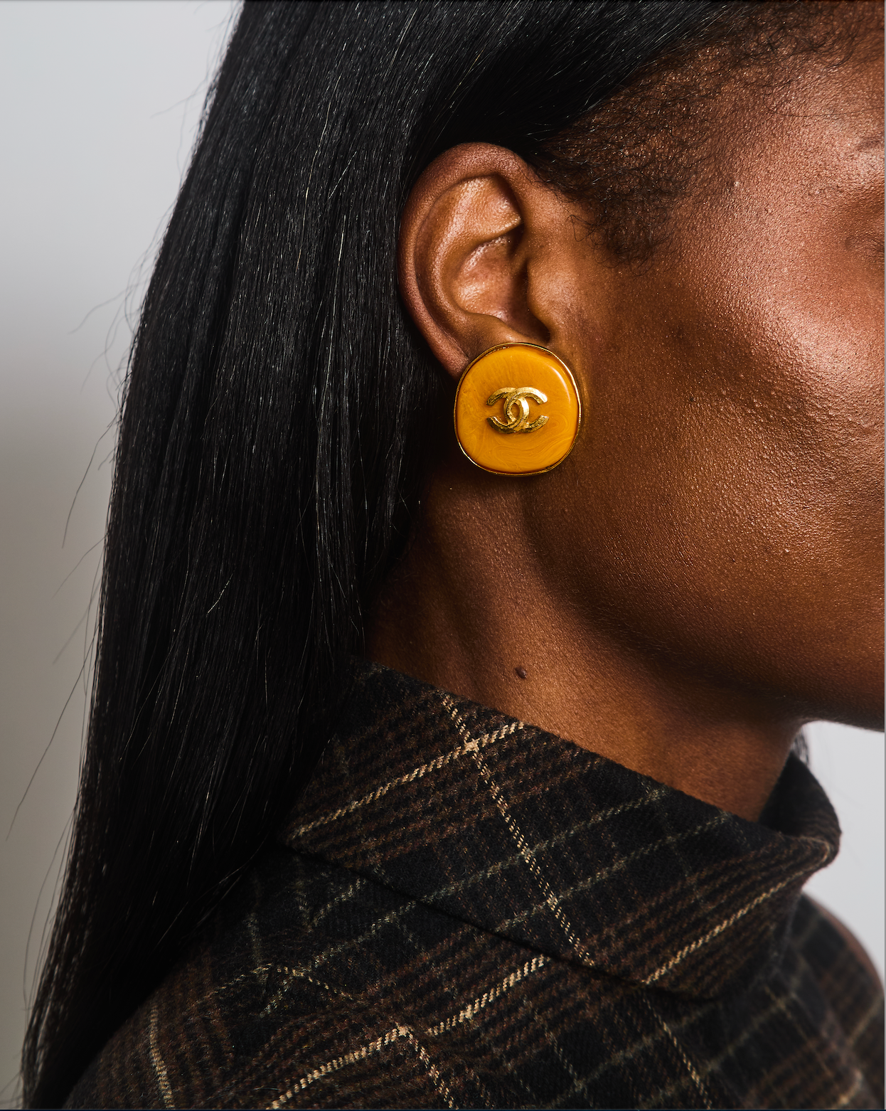Chanel   98P Orange Rounded Clip On Earrings with Gold Rim and CC Logo Detail