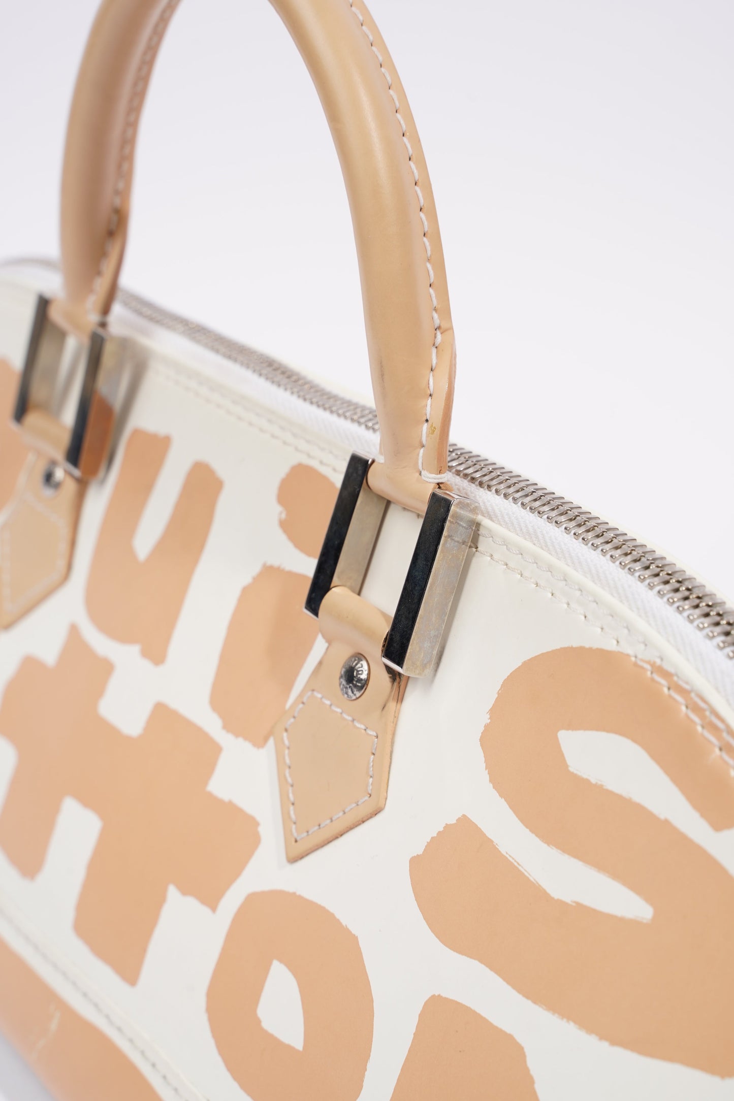 Louis Vuitton Alma Long Stephen Spro  White / Nude Coated Canvas
