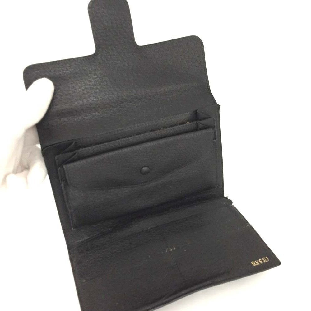 Unique,  , Gucci, RARE, black leather, clutch style purse or extra large wallet with a gold horse-bit accent at the clasp