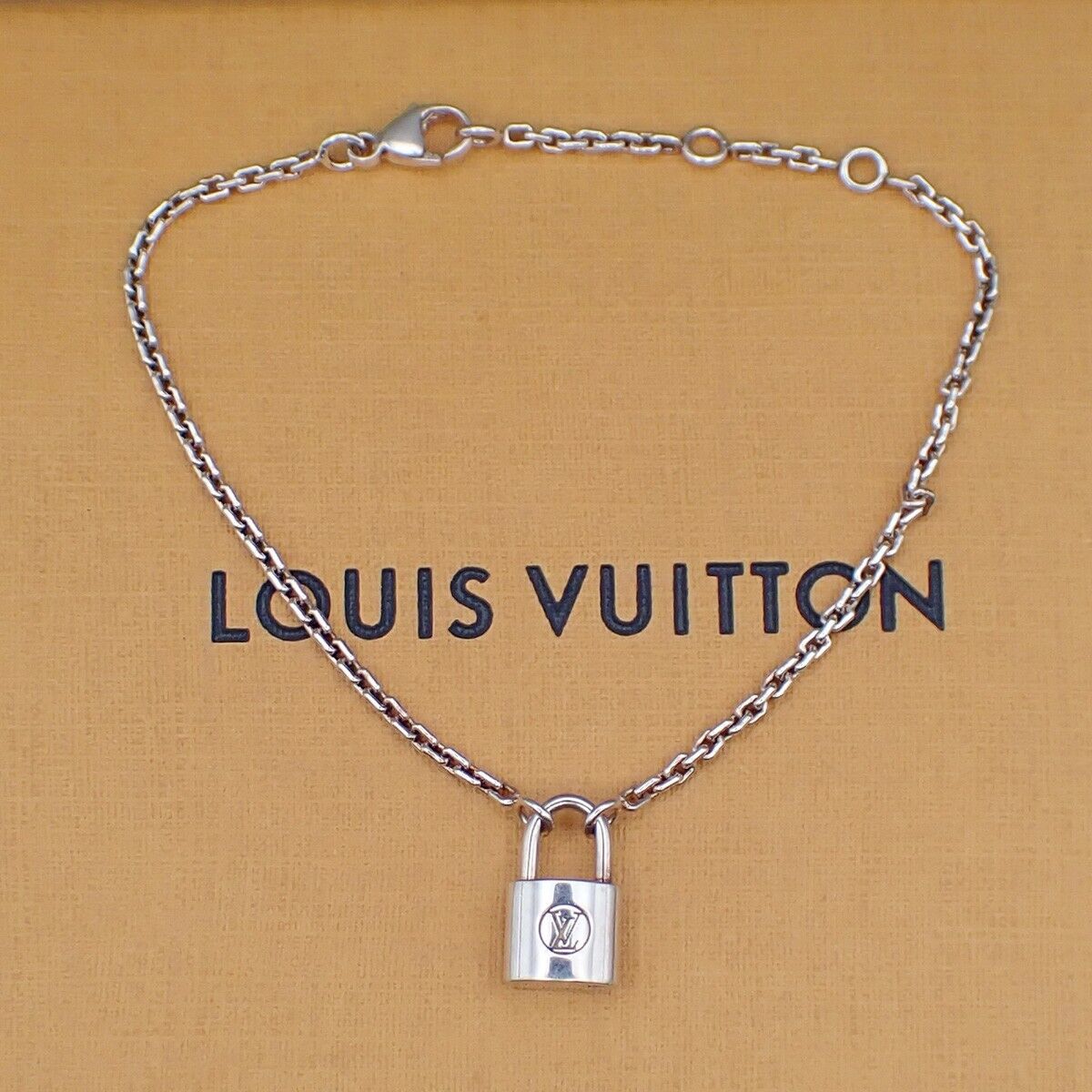 Louis Vuitton Lv Logo Padlock Motif
