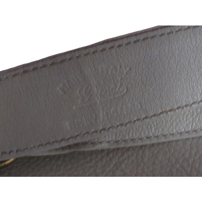 1970s Gucci white textured leather Blondie style saddle bag with XL gold GG logo cutout in mint condition