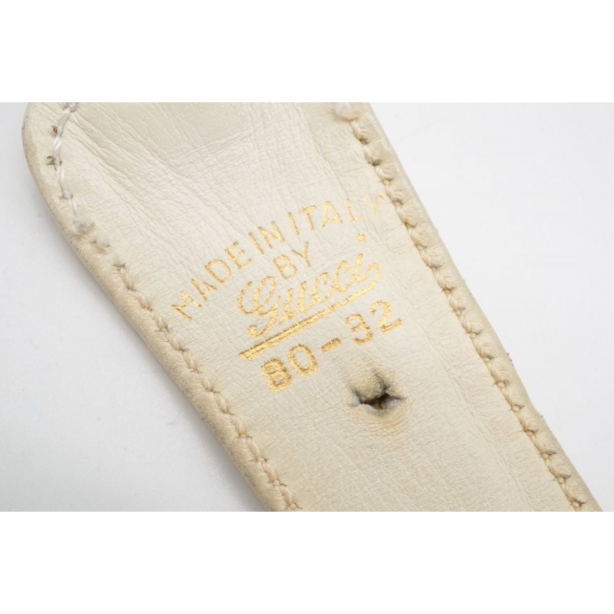 , Gucci, size 80/32, white leather belt with a round, gold buckle with red and blue enamel & two braided leather strands