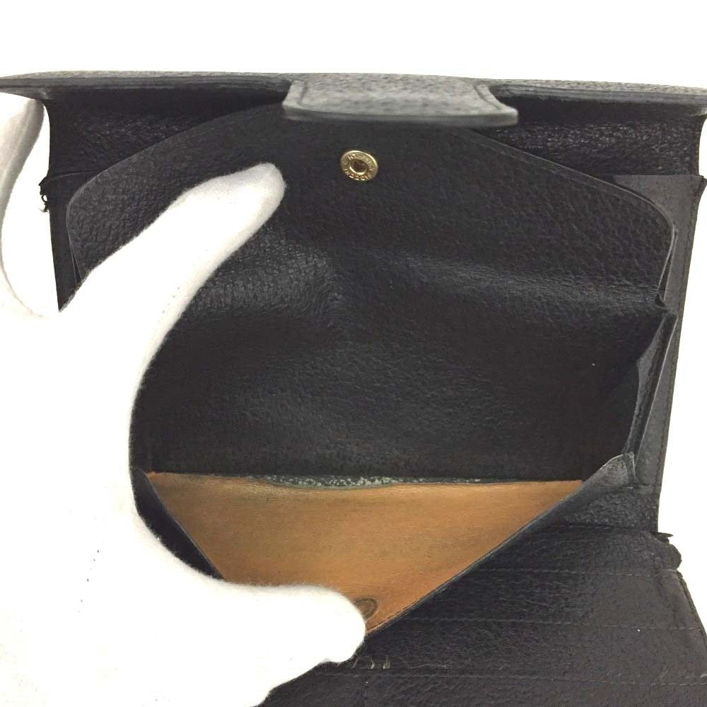 Unique,  , Gucci, RARE, black leather, clutch style purse or extra large wallet with a gold horse-bit accent at the clasp