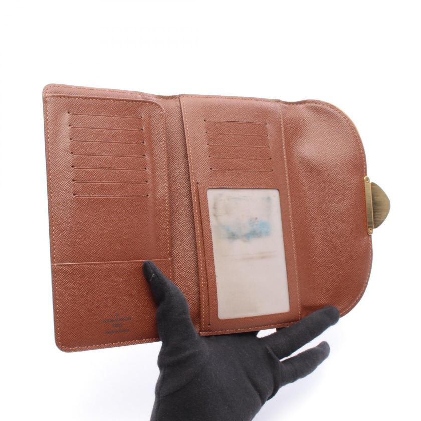 Pre-loved LOUIS VUITTON Portefeuil monogram trifold long wallet PVC Brown 2101219262260